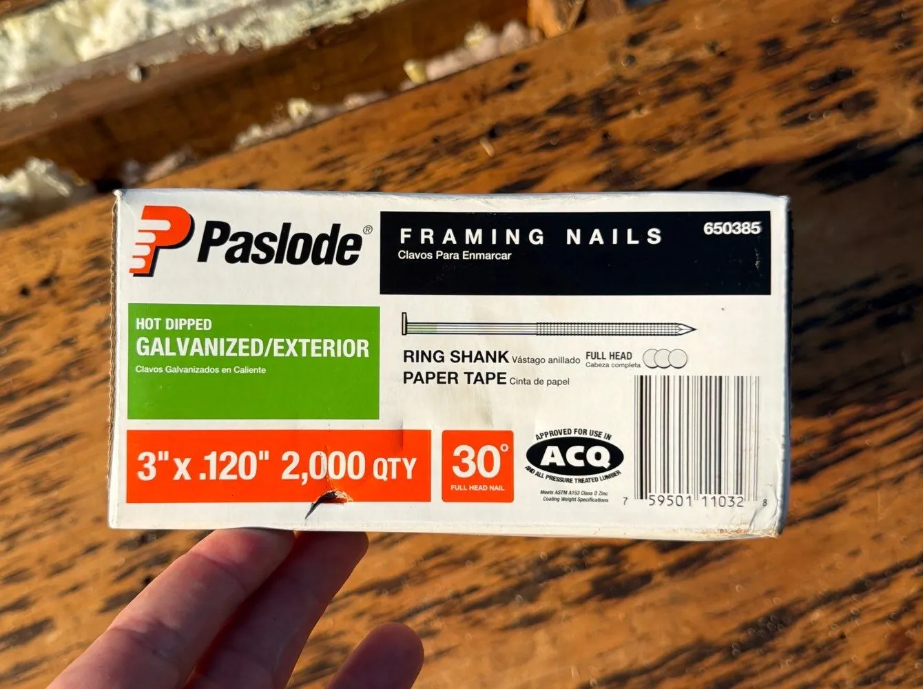 Box of Paslode ring-shank framing nails on the roof deck