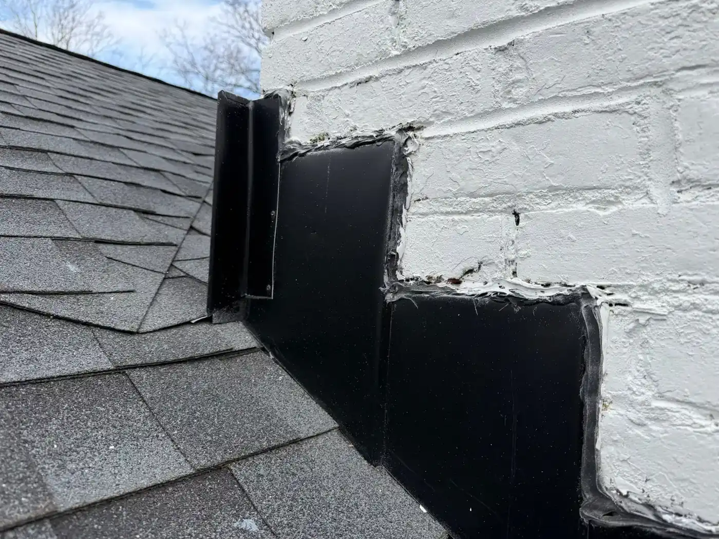 Old parapet wall where it met the shingled roof