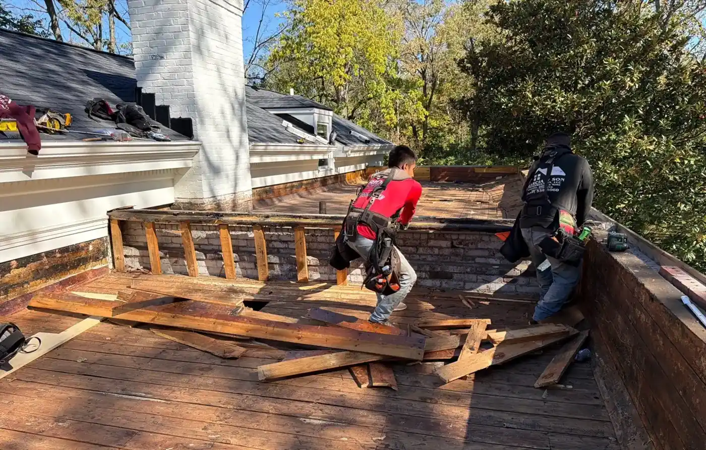 Crew removing old decking on the flat section